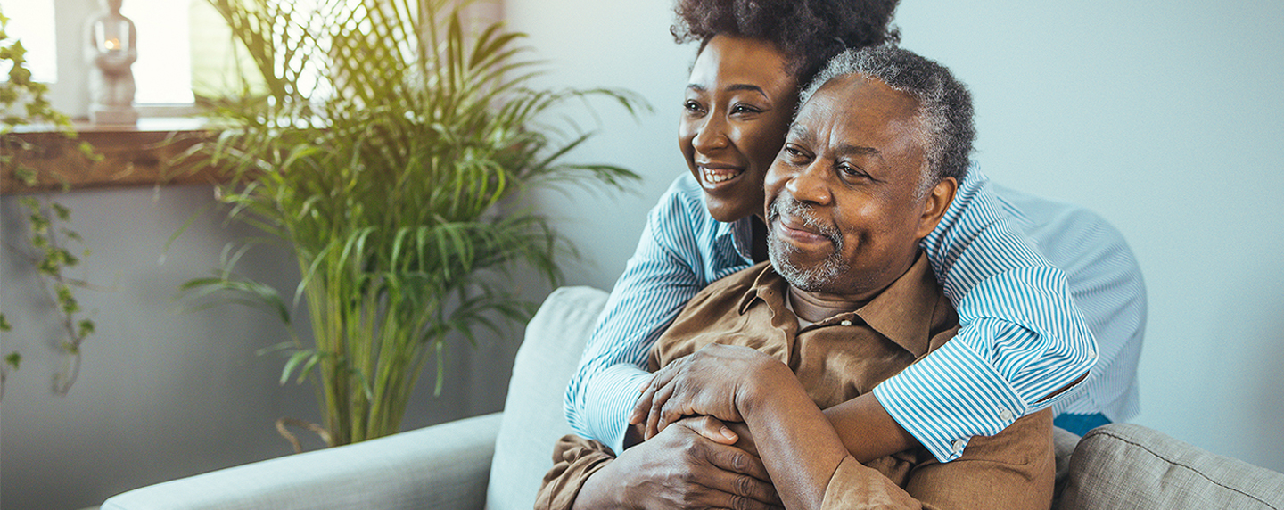 Granddaughter running with outstretched arms towards her grandmother | BCBS of Tennessee