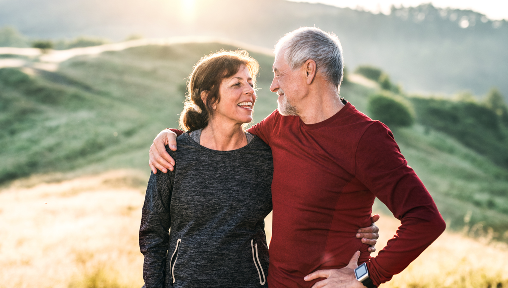 Older couple embracing and smiling at each other while hiking in the mountains | BCBS of Tennessee
Older couple embracing and smiling at each other while hiking in the mountains | BCBS of Tennessee