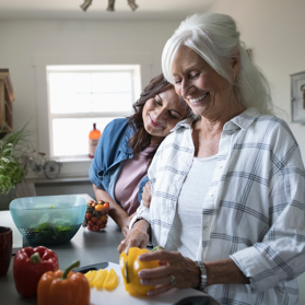 Daughter resting head on her mother’s shoulder | BCBS of Tennessee