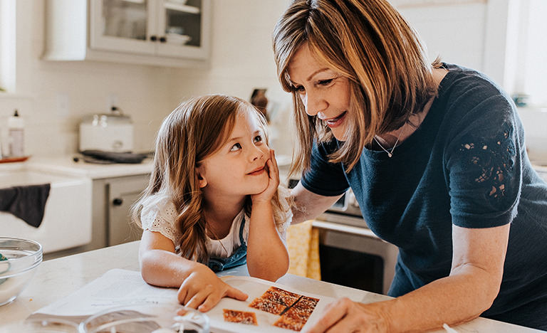 grandmother and toddler reading recipe