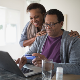 Woman putting her hands on man’s shoulders | BCBS of Tennessee