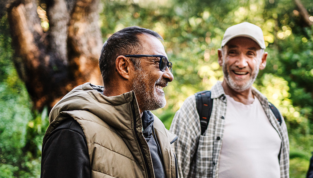 Two men hiking in the woods. Two men hiking in the woods.