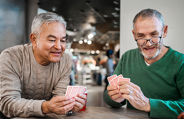 Two older men playing poker.