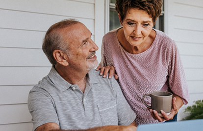 Older couple looking at information on their laptop